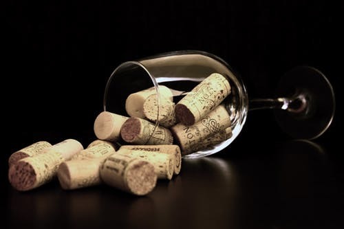 Content cork bowls wine glass of wine